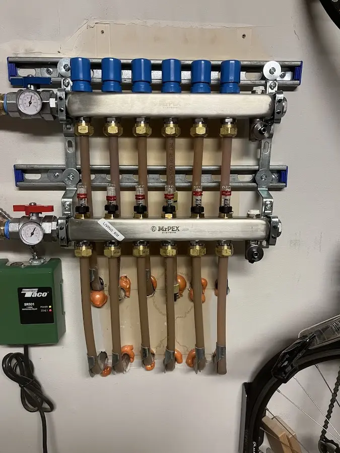 Plumber performing Water Heater Repair at a residential property in Tichigan